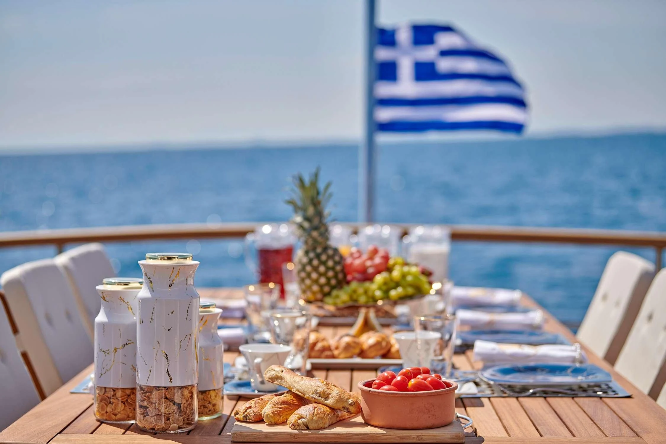 a table with food and drinks on it aboard WIDE LIBERTY Yacht for Sale