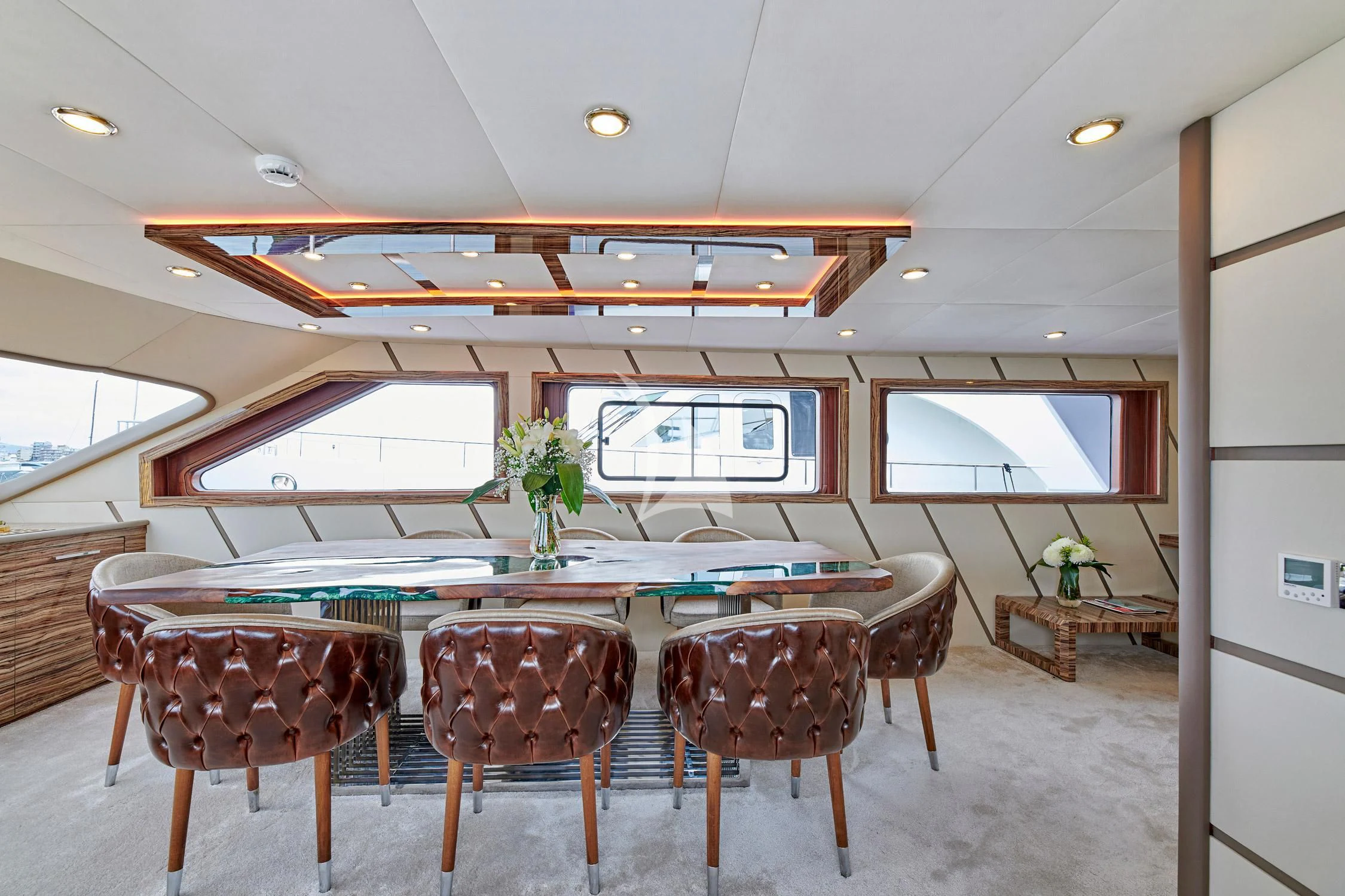 a room with a table and chairs aboard WIDE LIBERTY Yacht for Sale