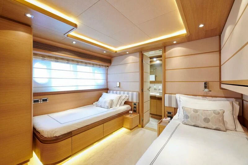 a room with a couple of beds aboard SEVEN S Yacht for Charter