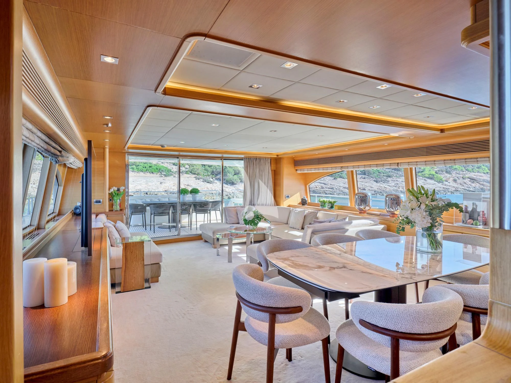 a large living room with a large open window aboard SEVEN S Yacht for Charter