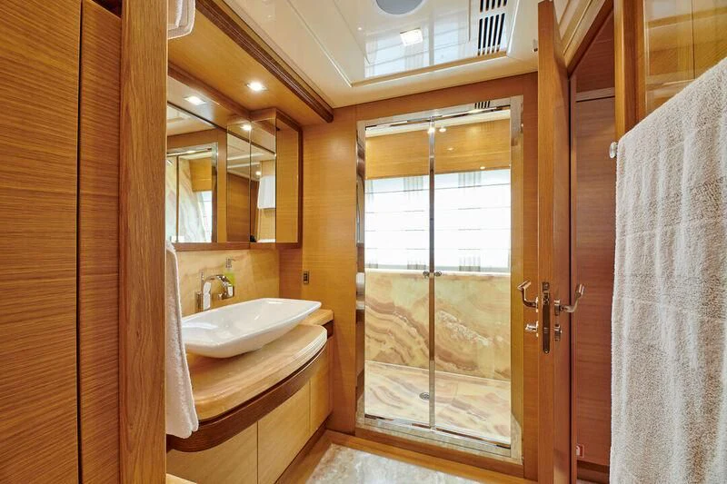 a bathroom with a sink and a shower aboard SEVEN S Yacht for Charter