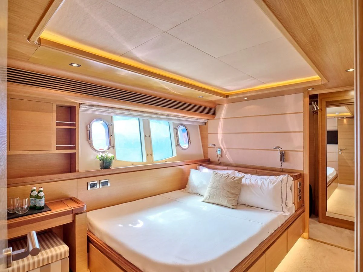 a bedroom with a bed aboard SEVEN S Yacht for Charter