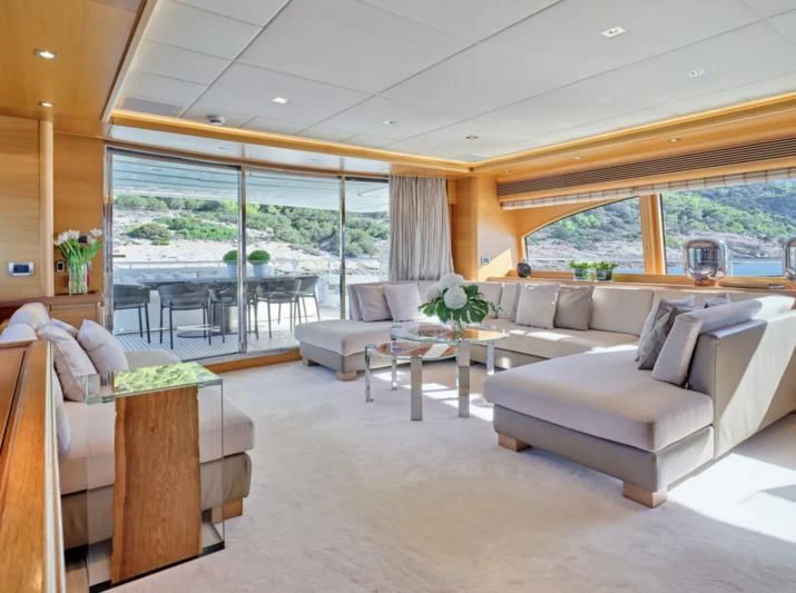 a living room with a large window aboard SEVEN S Yacht for Charter
