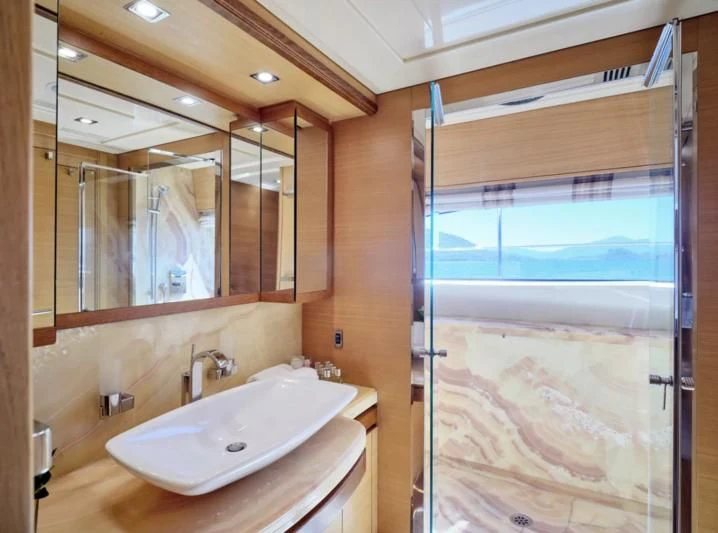 a bathroom with a large mirror aboard SEVEN S Yacht for Charter