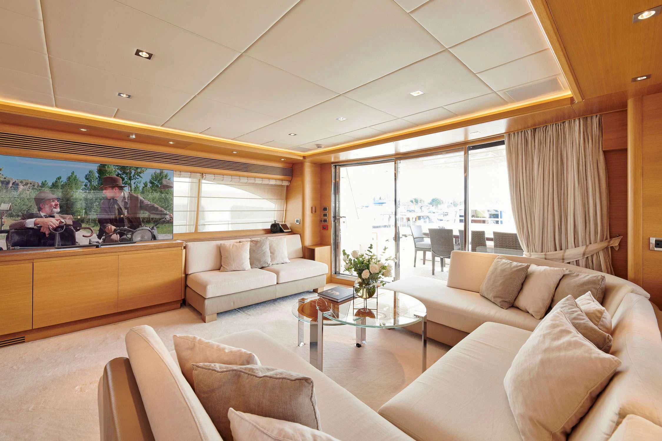 a living room with a large window aboard SEVEN S Yacht for Charter