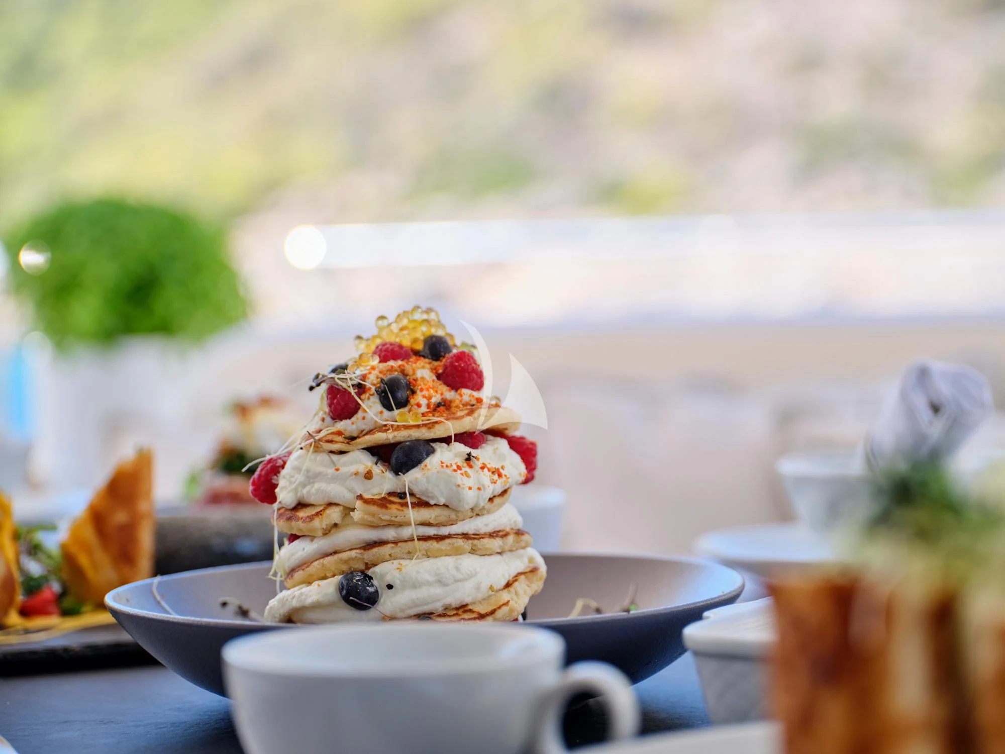 a dessert on a plate aboard SEVEN S Yacht for Charter