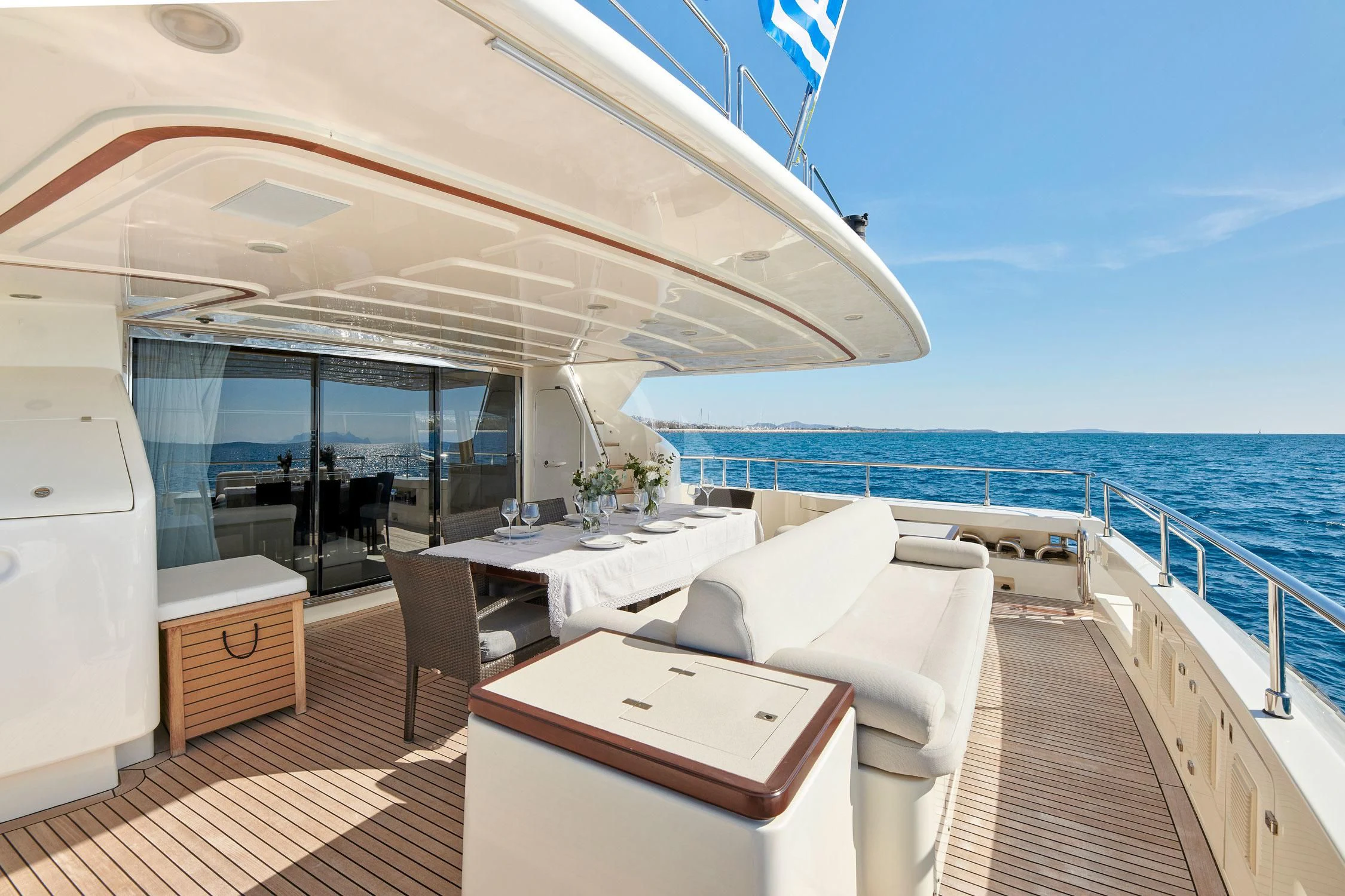 a room with a bed and a table on a boat aboard SEVEN S Yacht for Charter