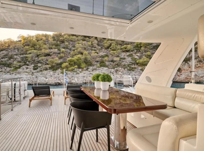 a table and chairs in a room aboard SEVEN S Yacht for Charter