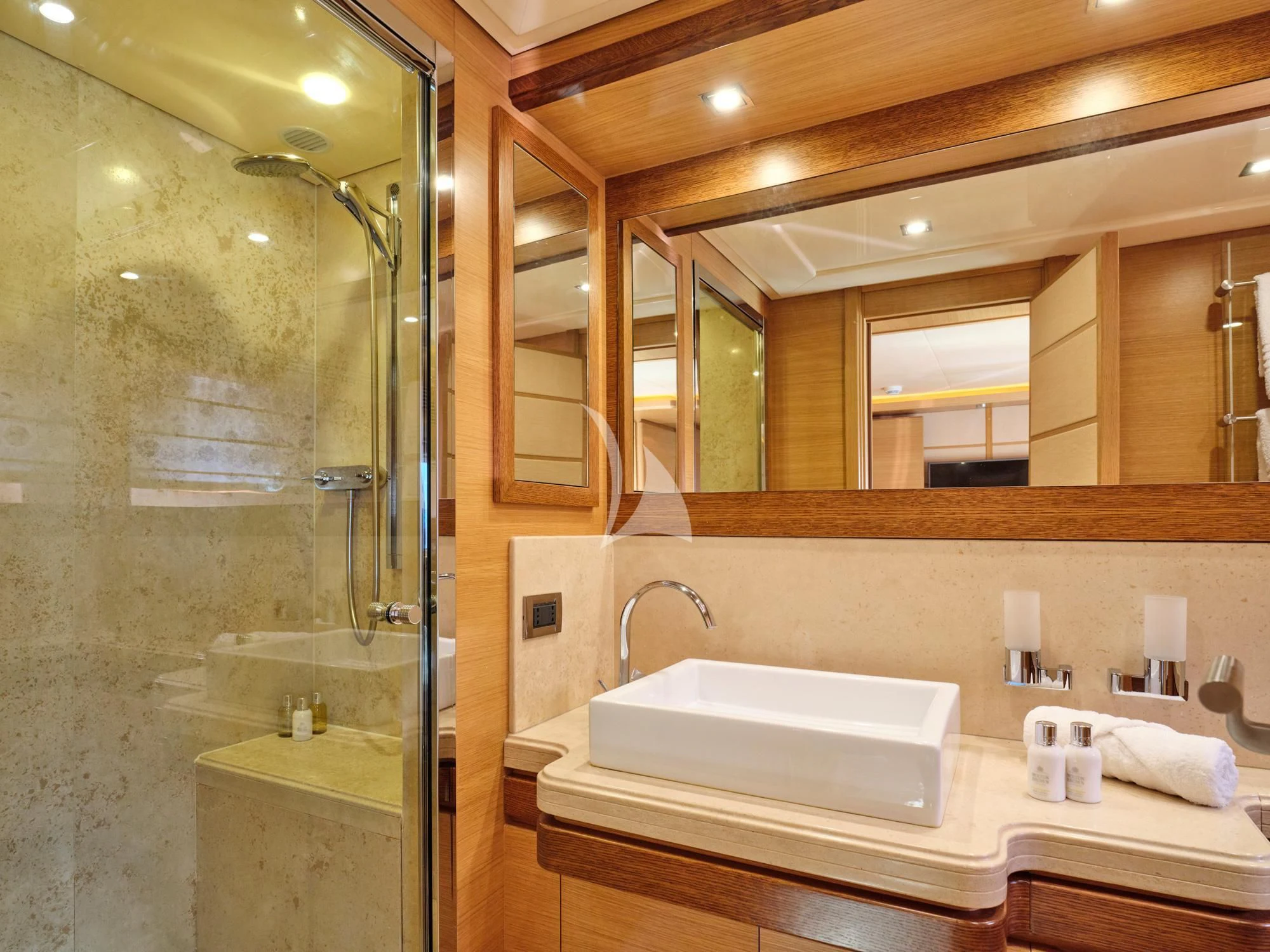 a bathroom with a glass shower aboard SEVEN S Yacht for Charter