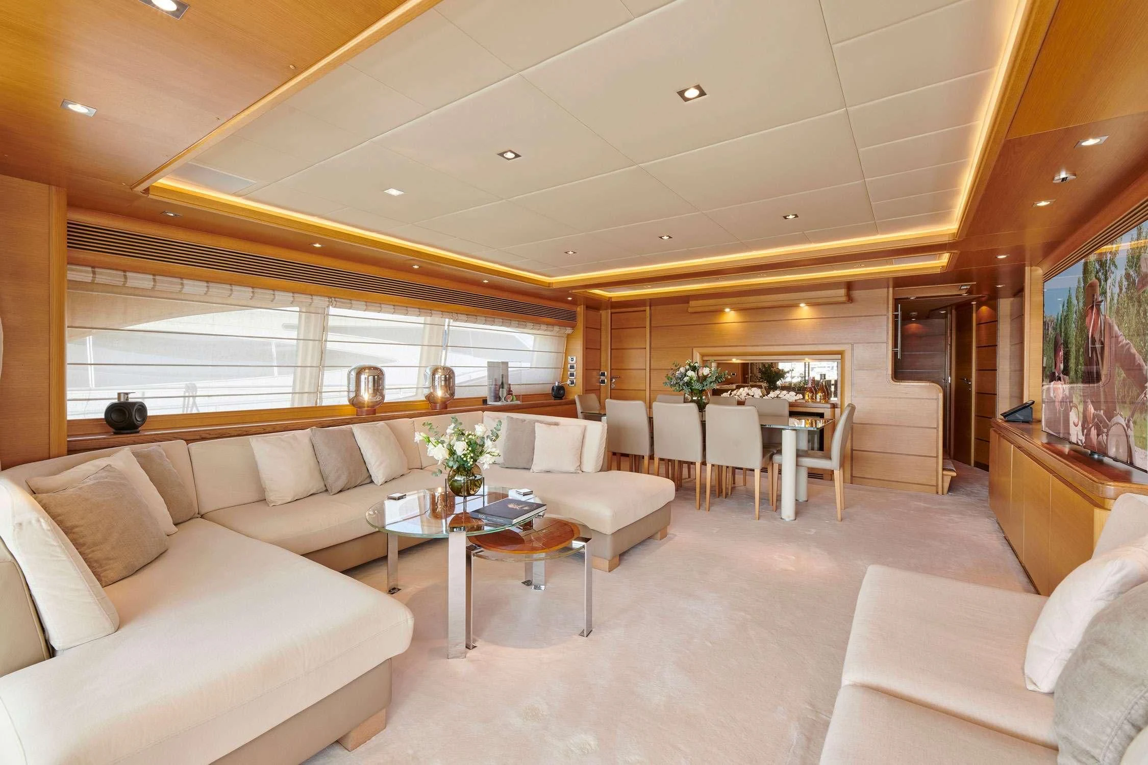 a living room with a large window aboard SEVEN S Yacht for Charter