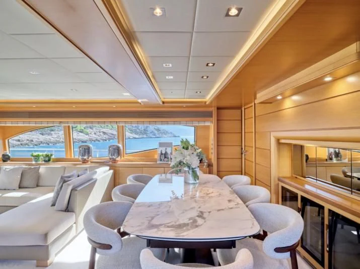a room with a table and chairs aboard SEVEN S Yacht for Charter