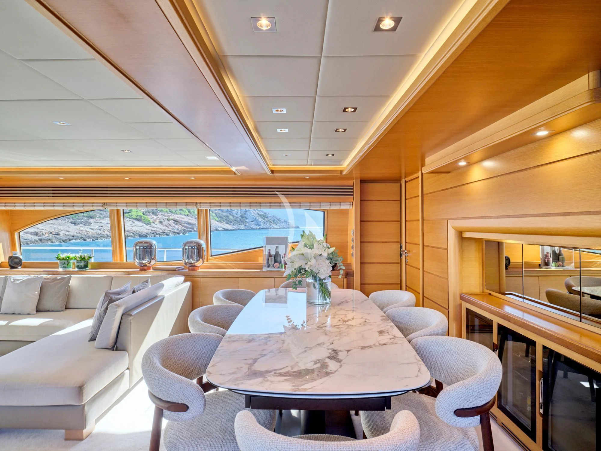 a room with a table and chairs aboard SEVEN S Yacht for Charter