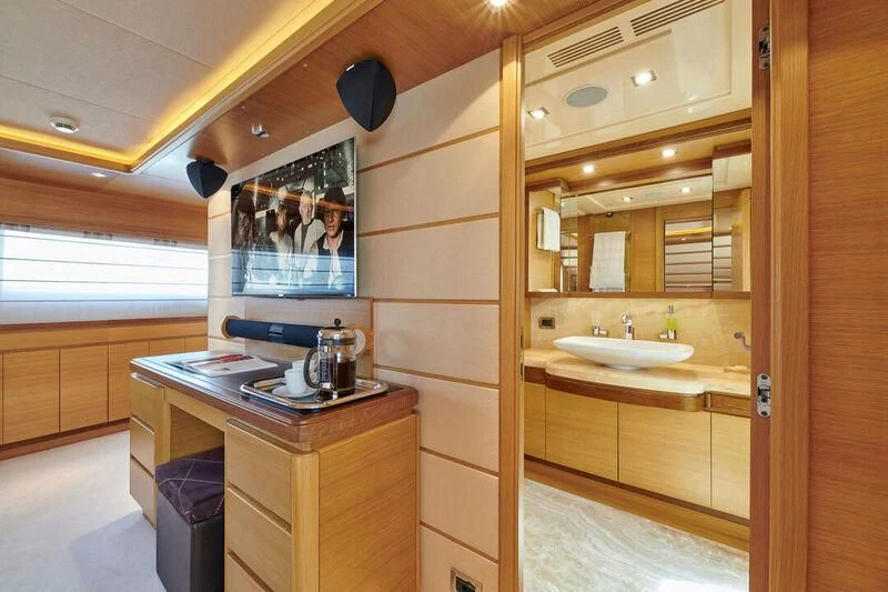 a bathroom with a sink and a mirror aboard SEVEN S Yacht for Charter