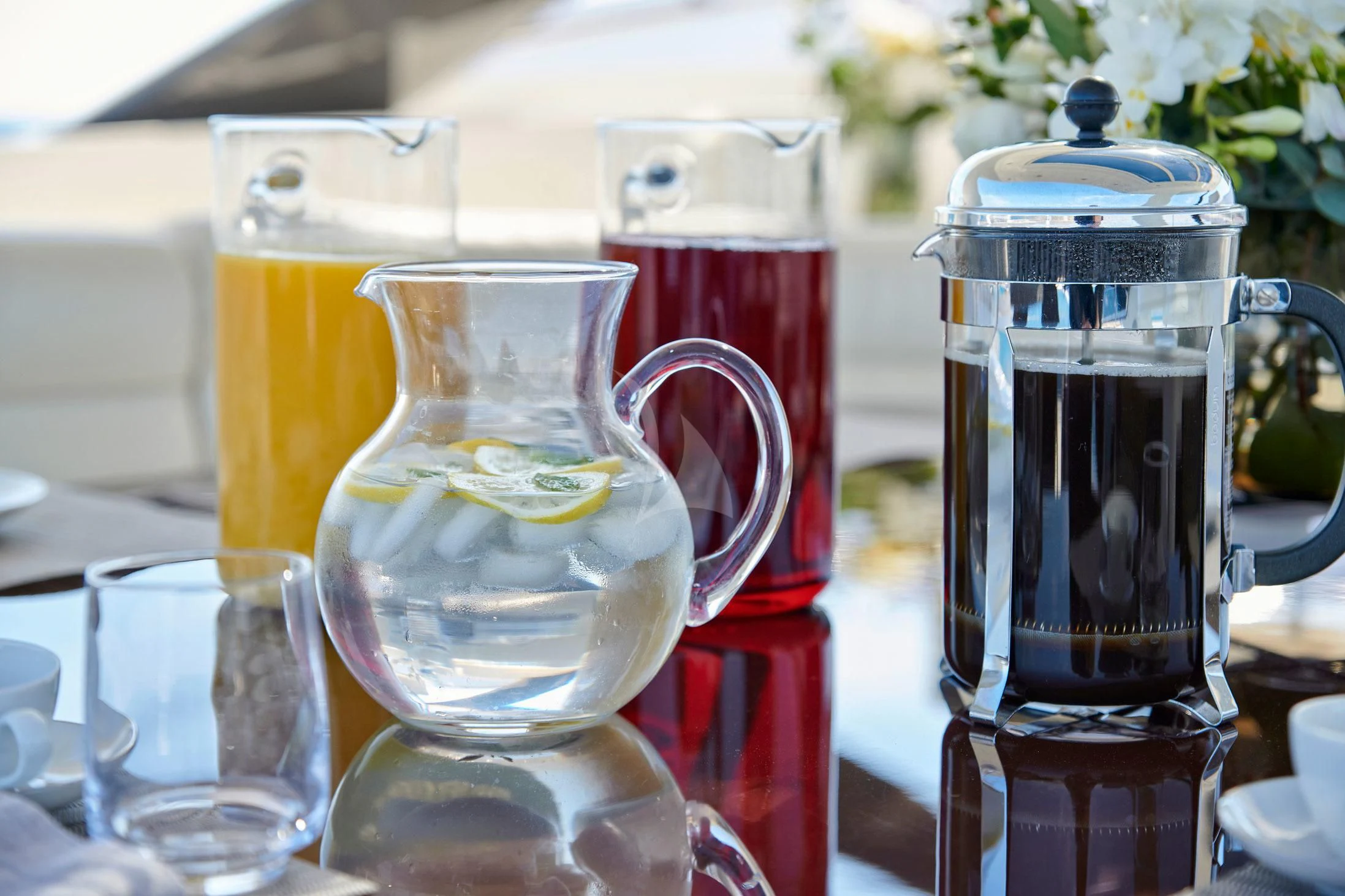 a group of glasses with liquid in them aboard SEVEN S Yacht for Charter