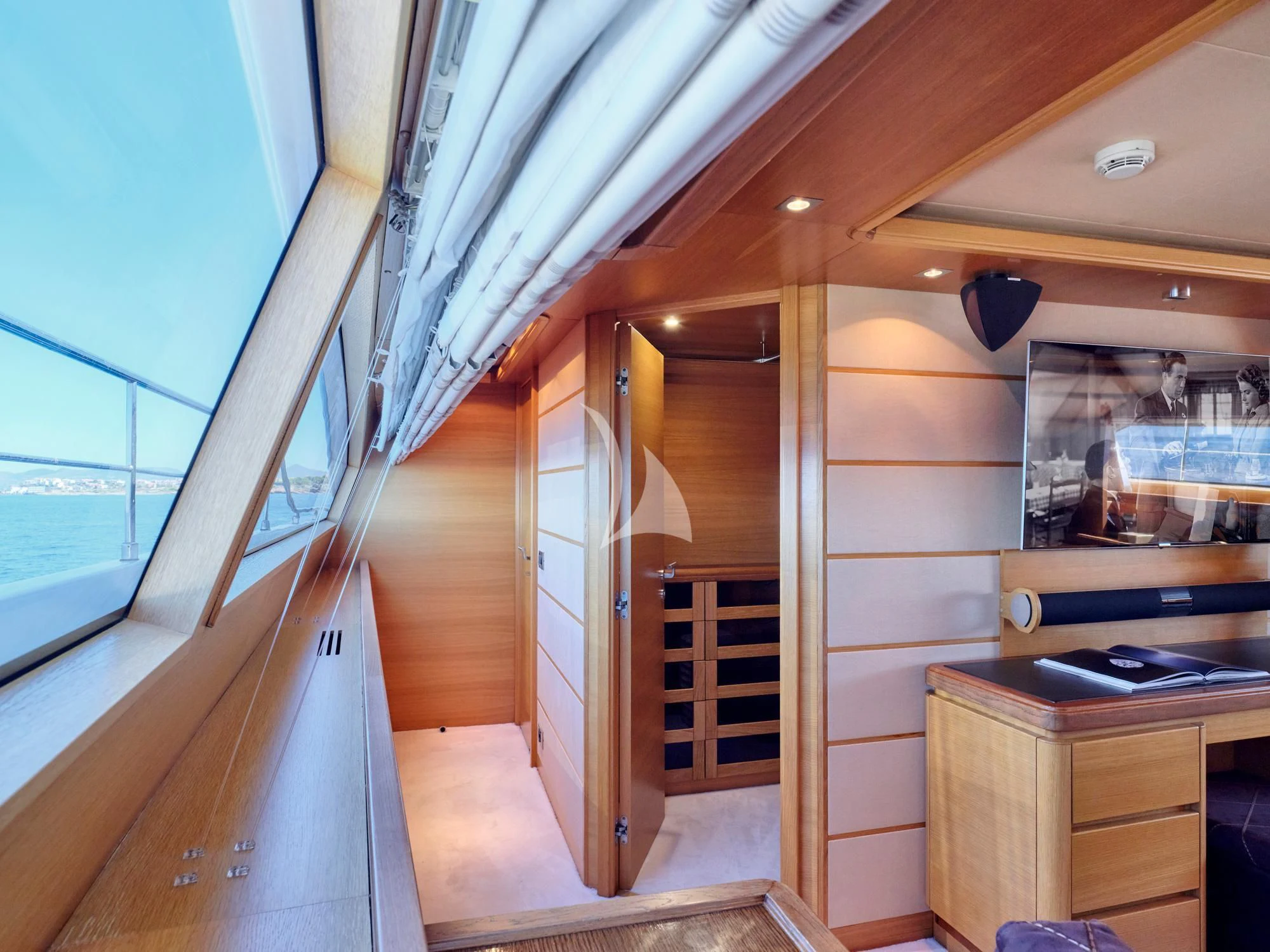 a room with wooden walls and a wood door aboard SEVEN S Yacht for Charter
