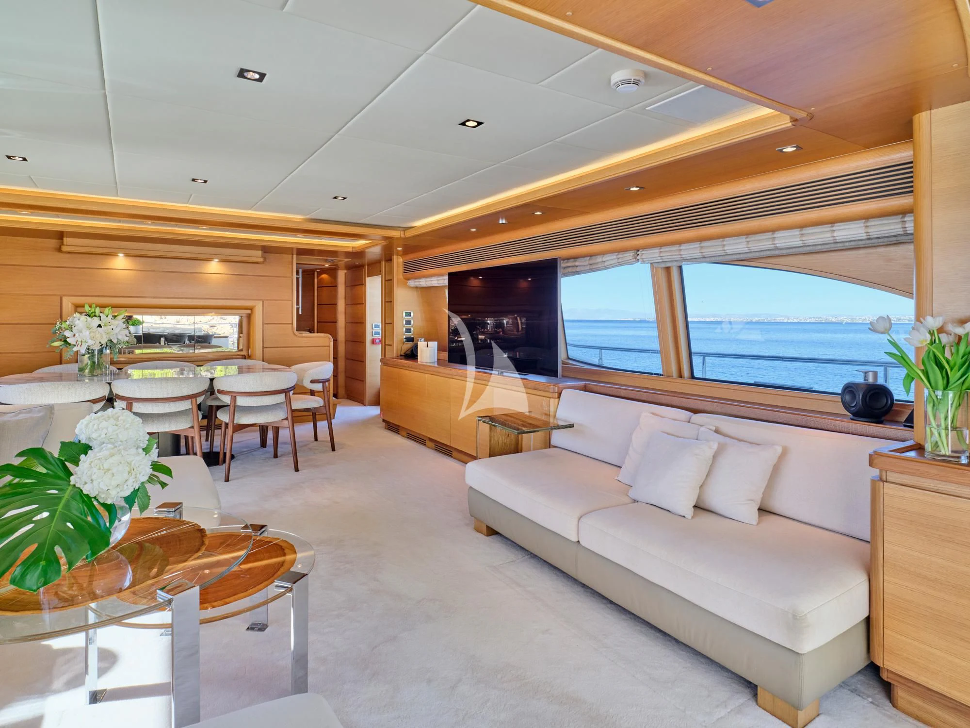 a living room with a large window aboard SEVEN S Yacht for Charter