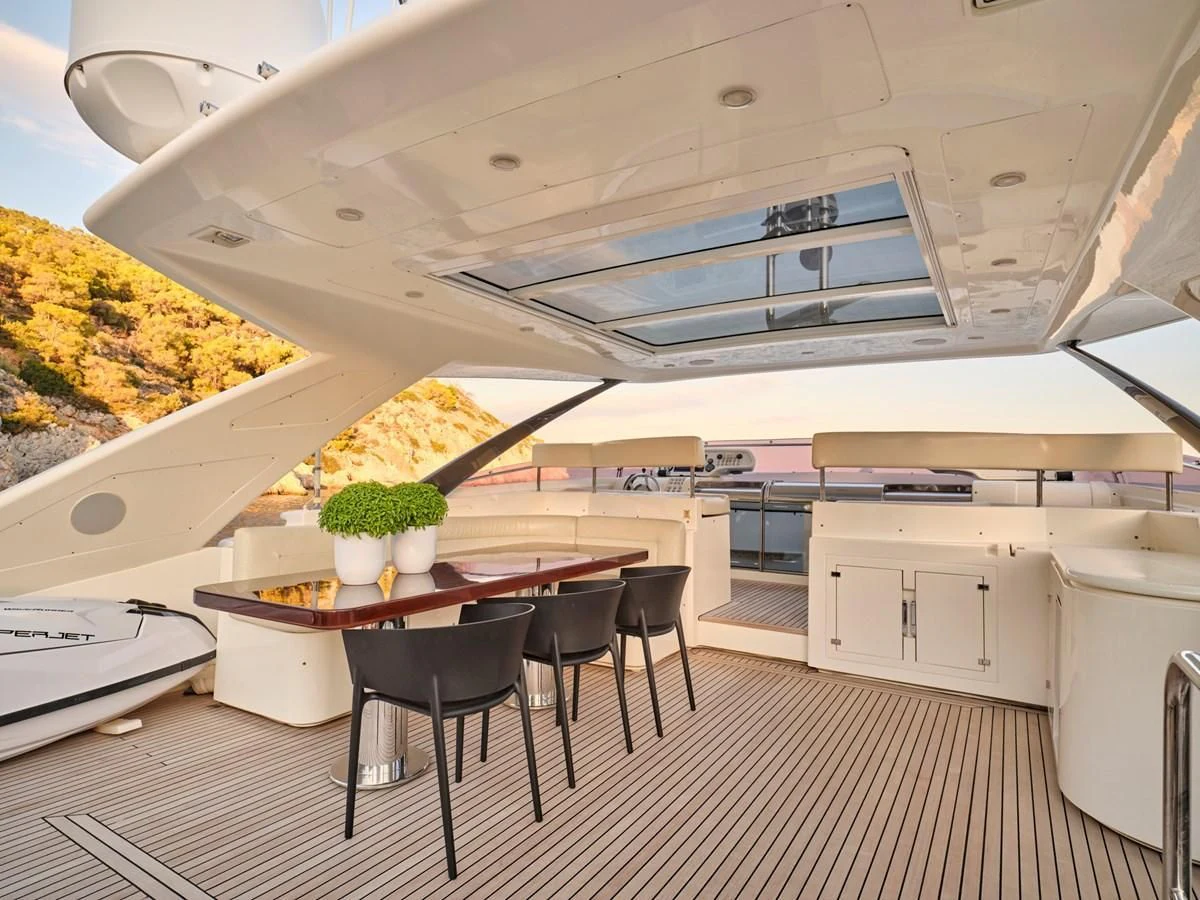 a kitchen with a large table and chairs aboard SEVEN S Yacht for Charter