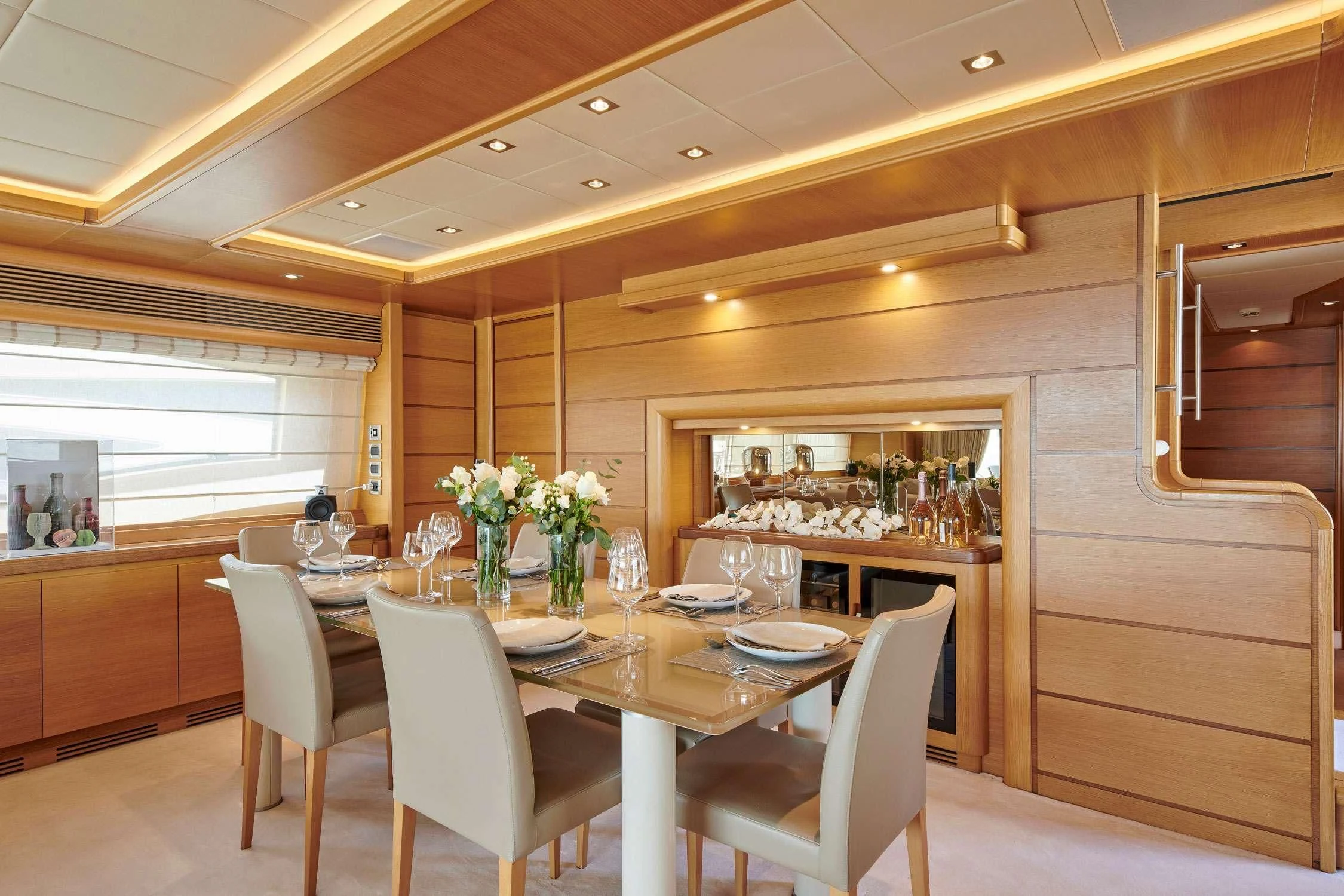 a dining room with a table and chairs aboard SEVEN S Yacht for Charter