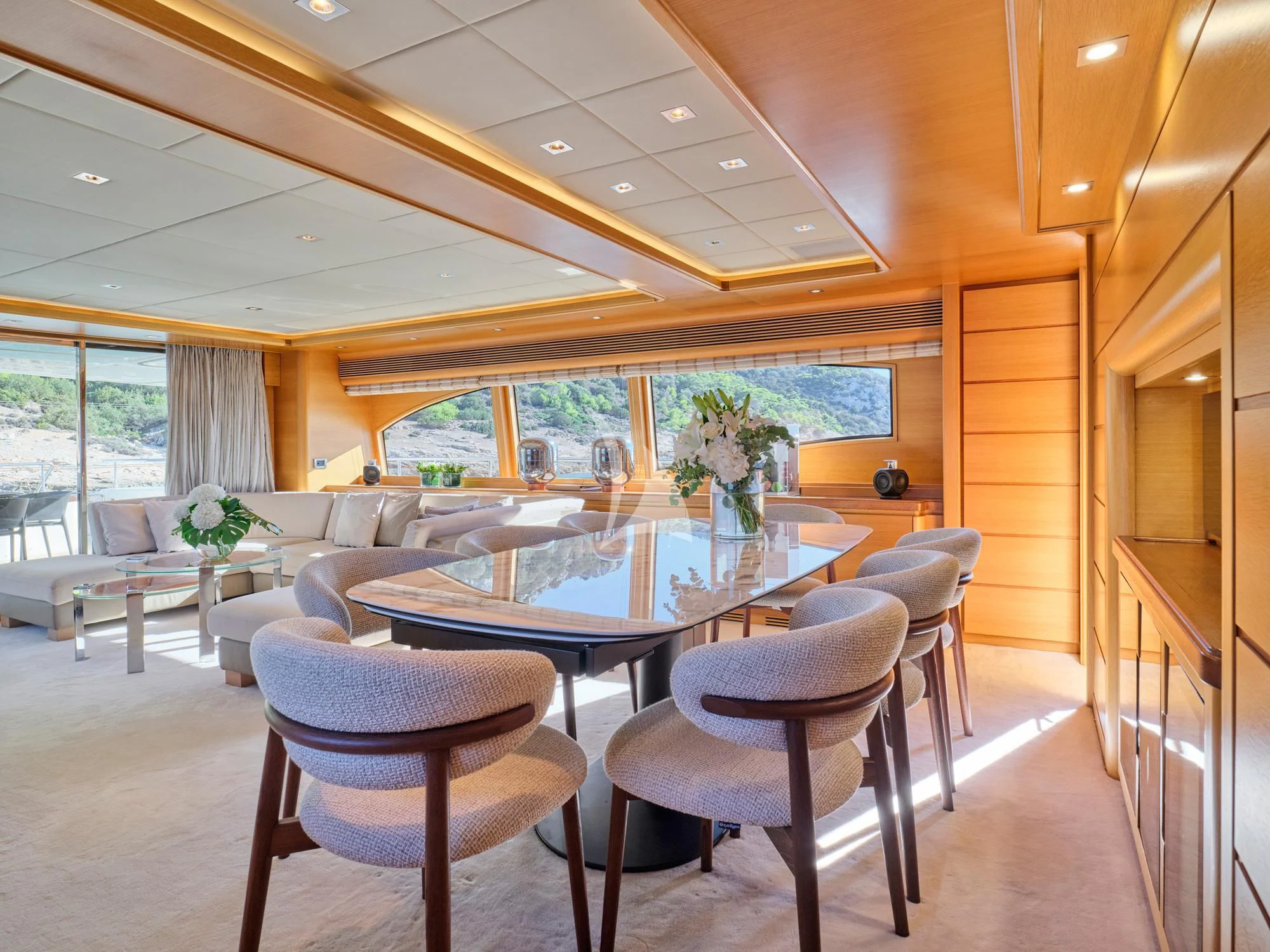 a large room with a table and chairs aboard SEVEN S Yacht for Charter