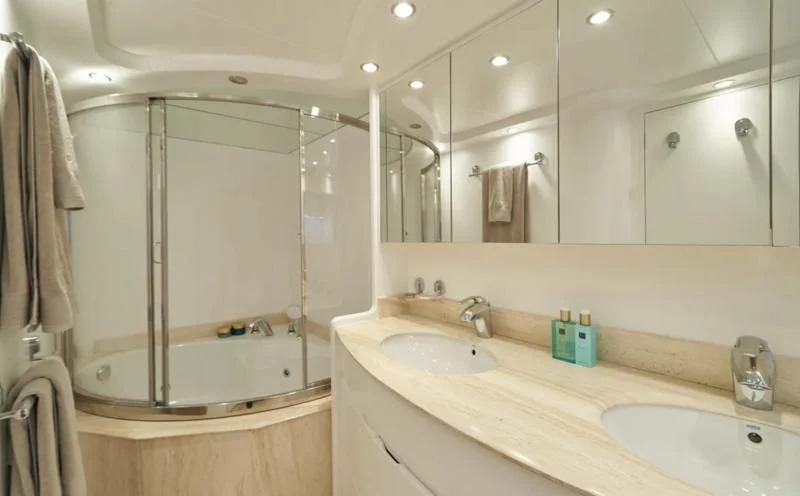 a bathroom with a large mirror aboard KIAWAH II Yacht for Sale