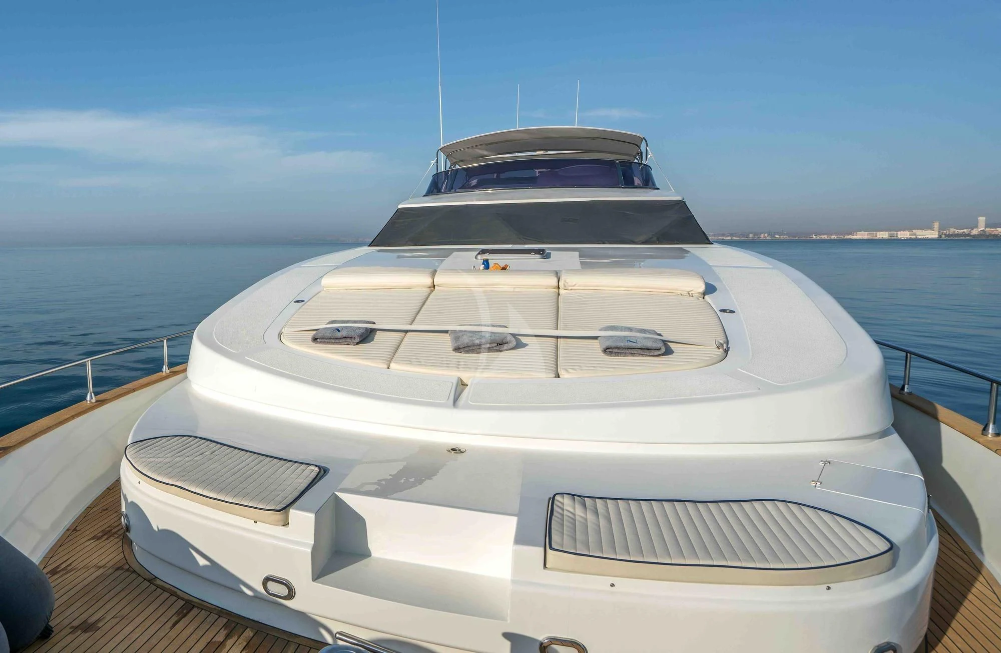 a white boat on a dock aboard KIAWAH II Yacht for Sale