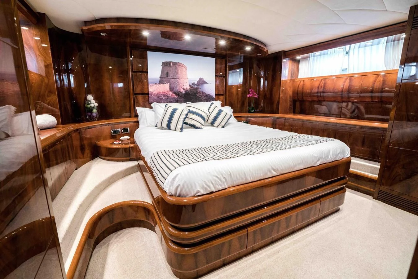 a room with a bed and a mirror aboard KIAWAH II Yacht for Sale