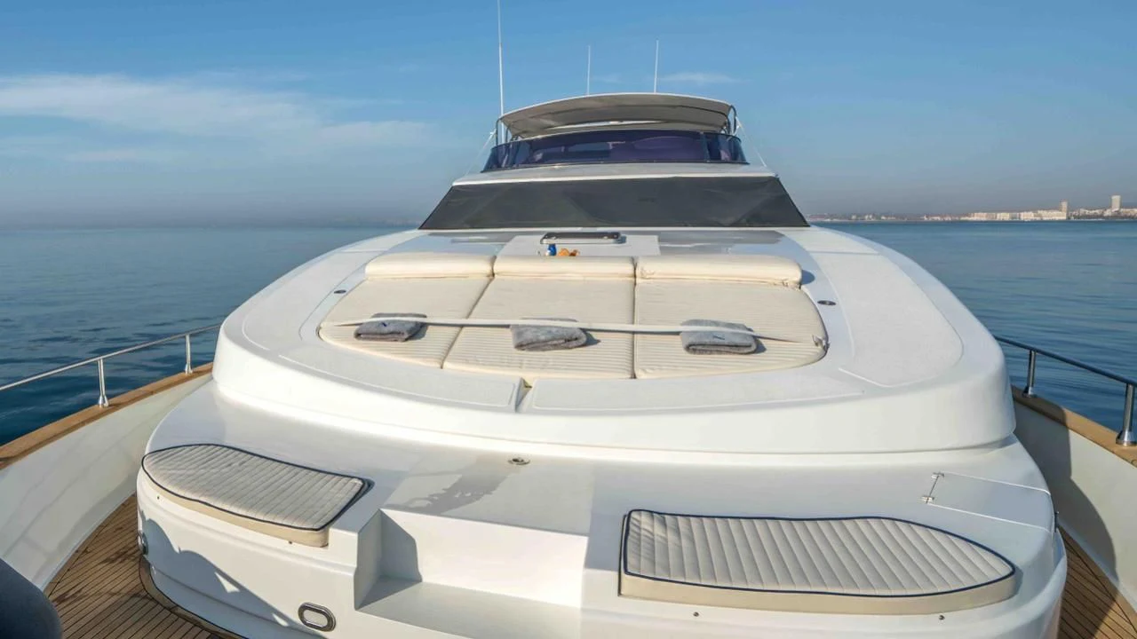 a white boat on a body of water aboard KIAWAH II Yacht for Sale