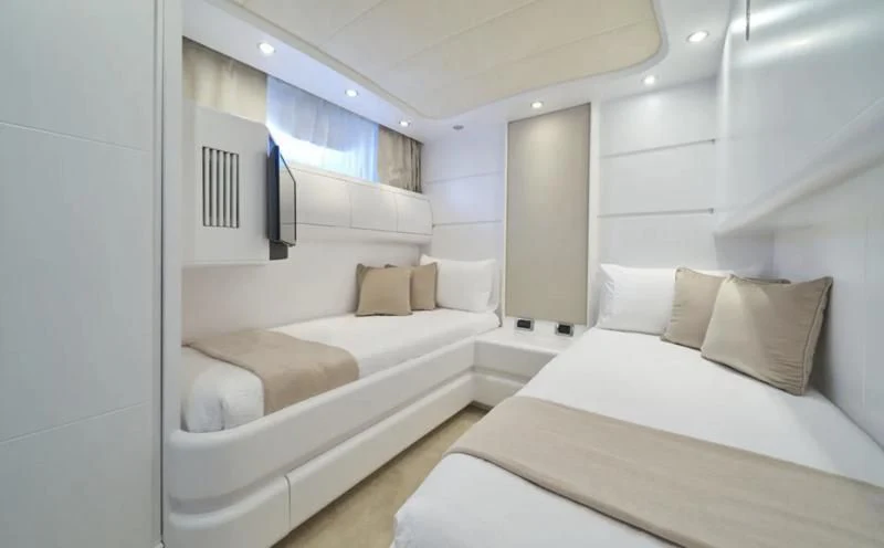 a room with a couple of beds aboard KIAWAH II Yacht for Sale