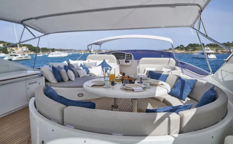 a boat with many seats aboard KIAWAH II Yacht for Sale