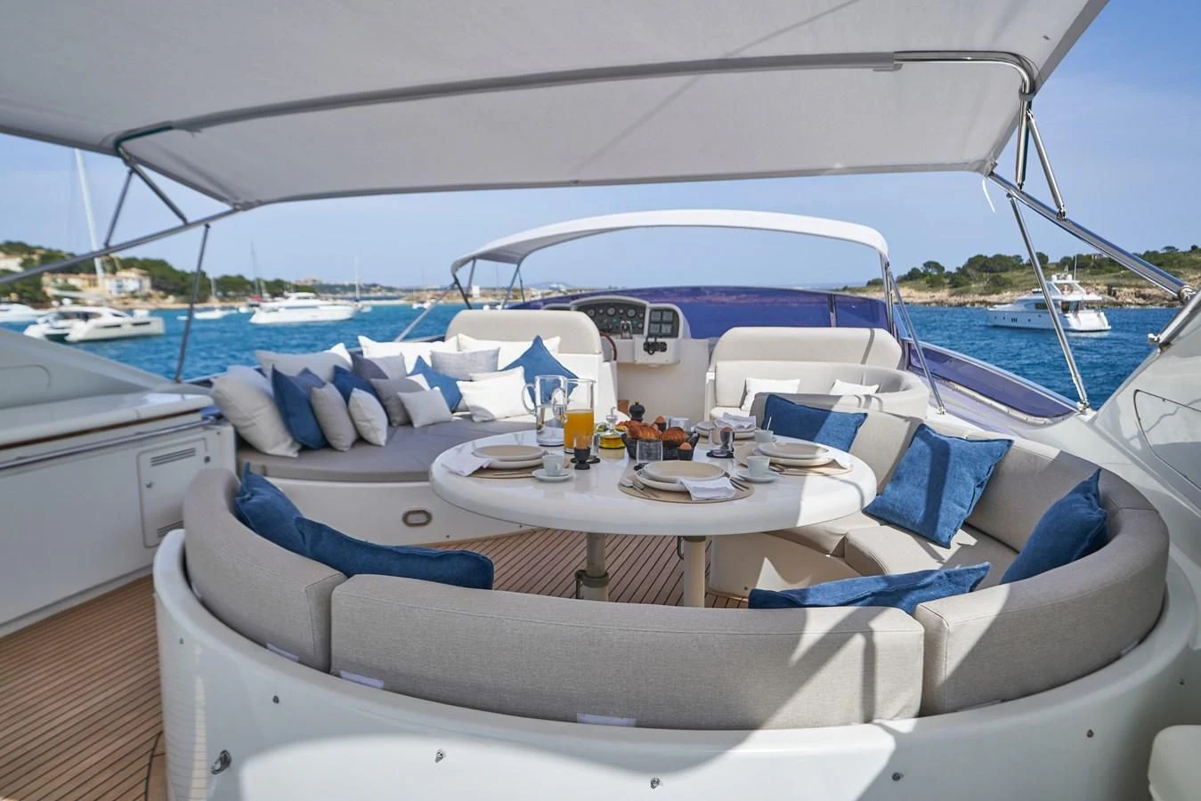 a boat with a table and chairs aboard KIAWAH II Yacht for Sale
