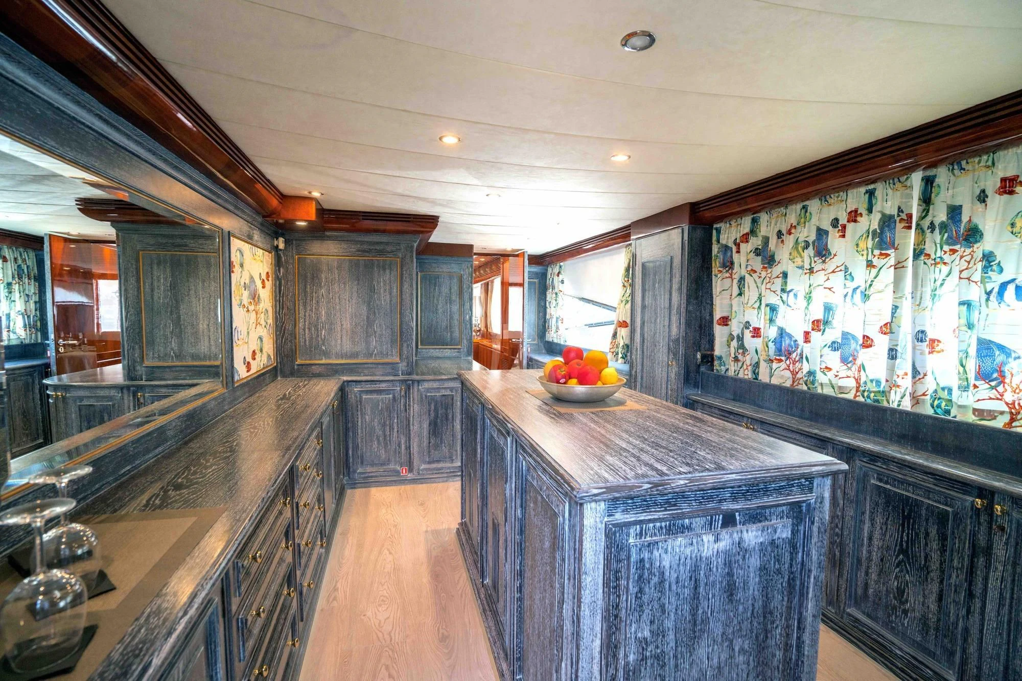 a kitchen with a marble counter top aboard KIAWAH II Yacht for Sale