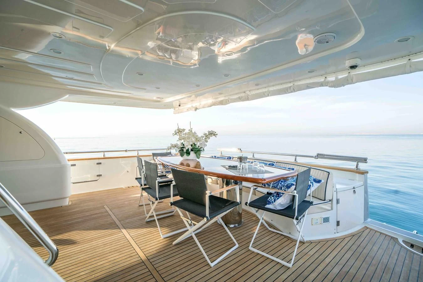 a room with a table and chairs aboard KIAWAH II Yacht for Sale