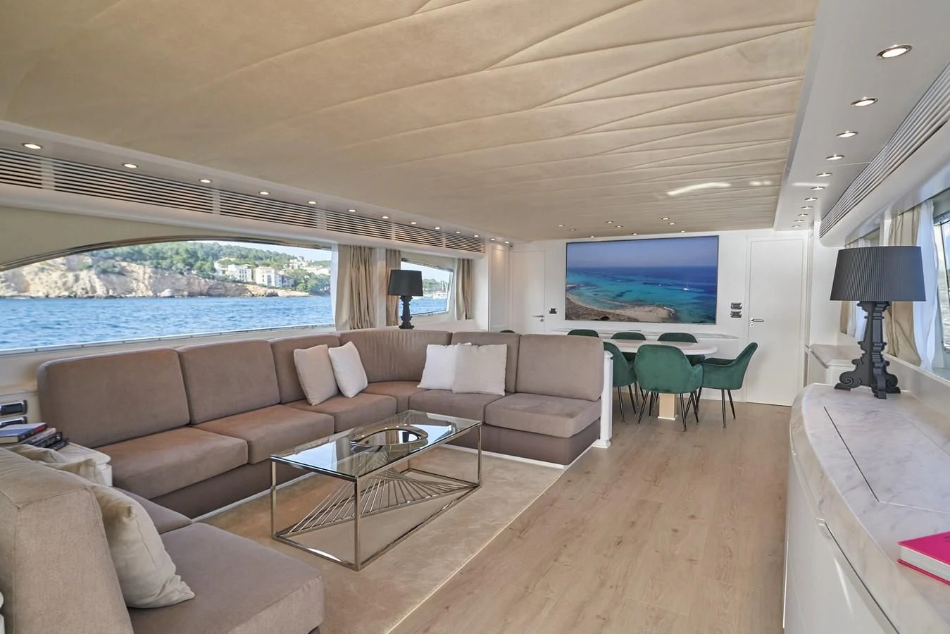 a living room with a large window aboard KIAWAH II Yacht for Sale