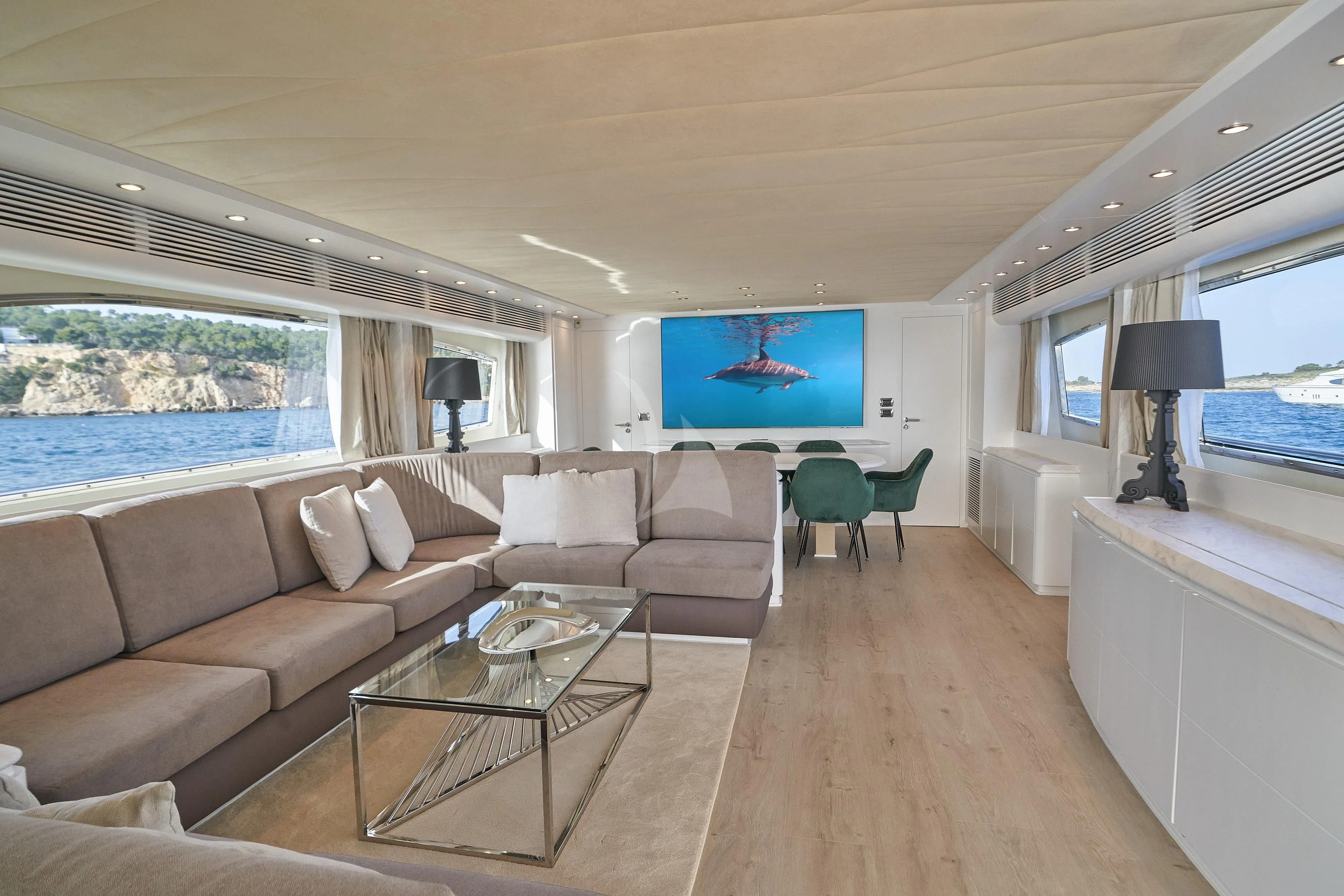 a living room with a large window aboard KIAWAH II Yacht for Sale