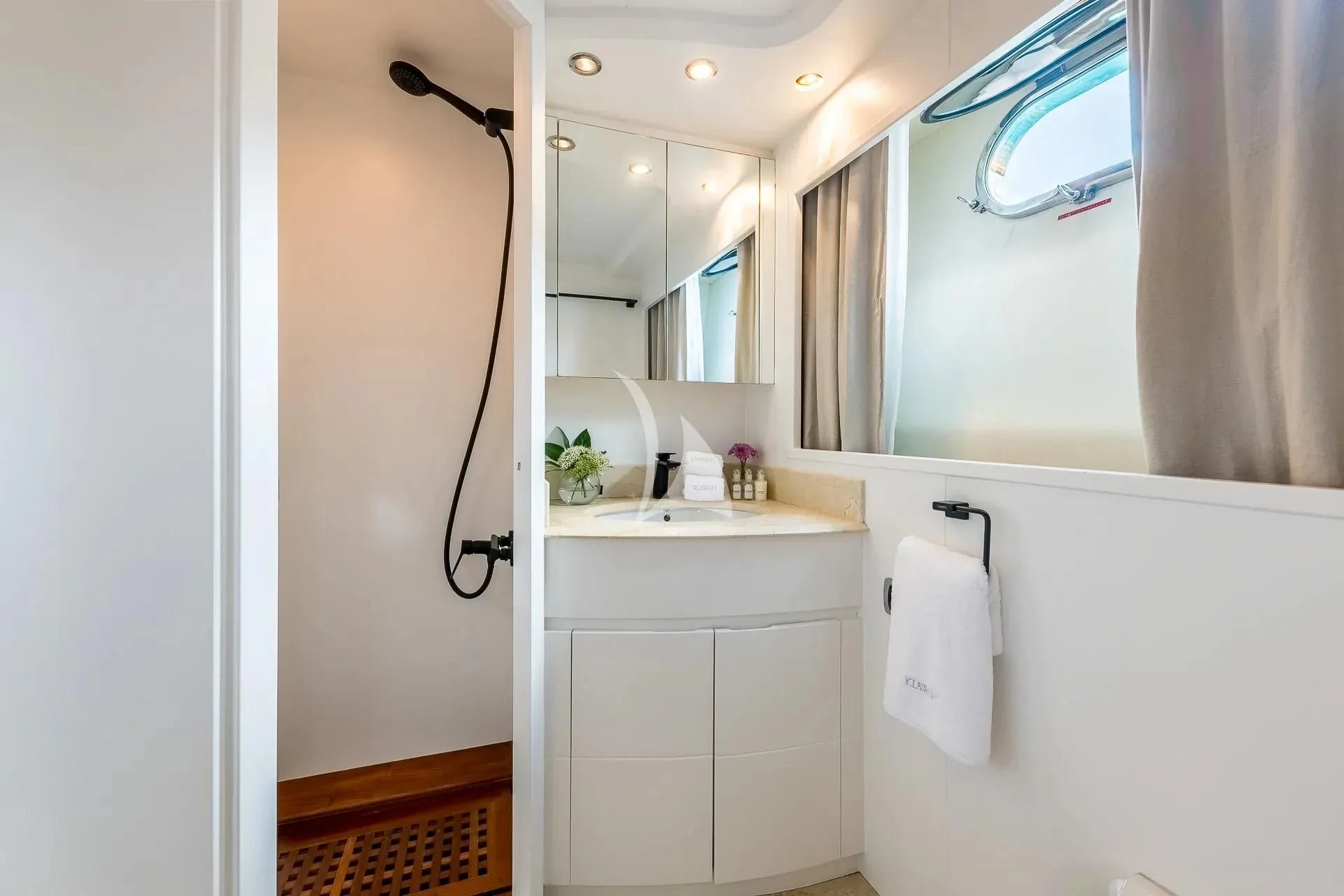 a bathroom with a sink and a mirror aboard KIAWAH II Yacht for Sale