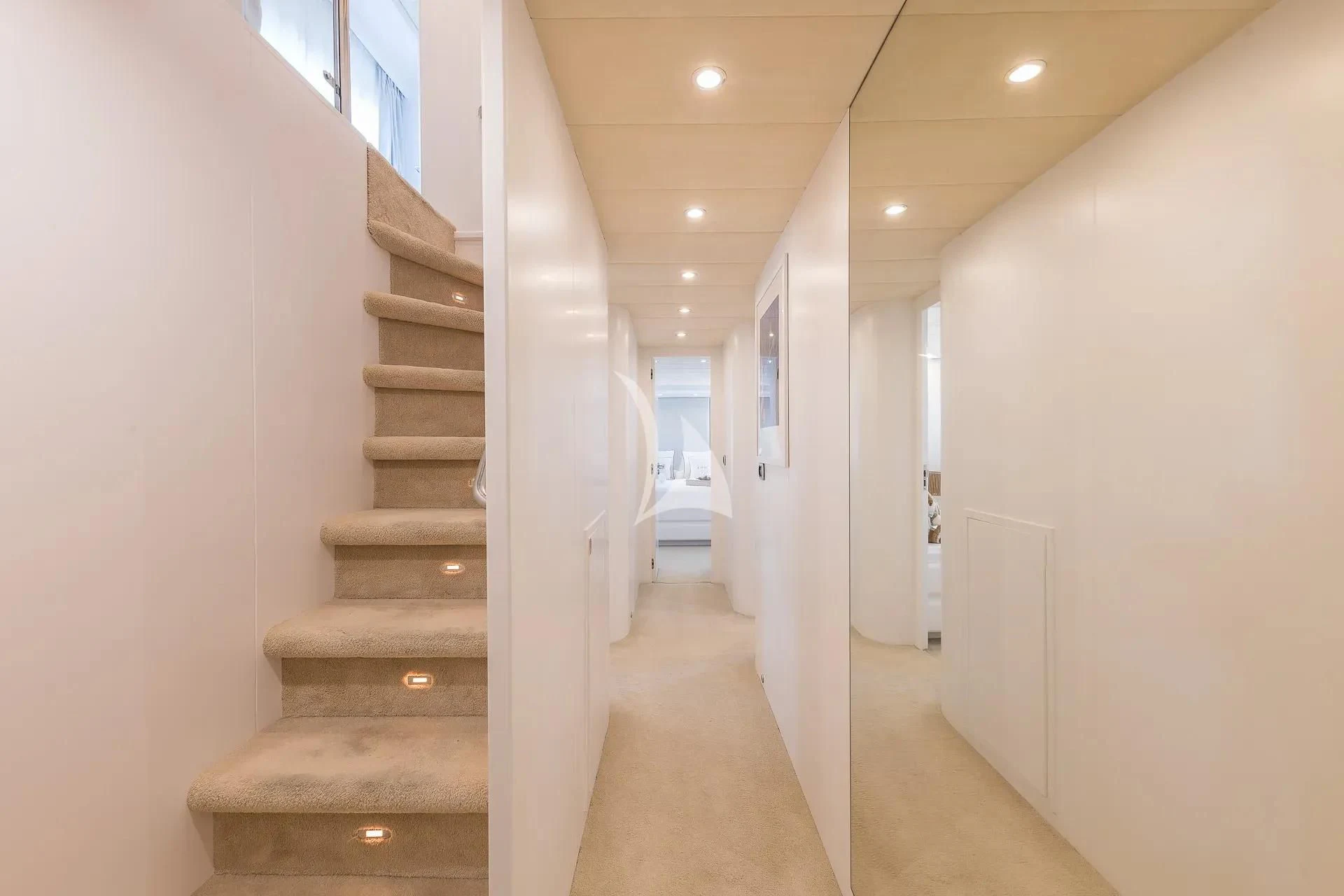 a hallway with white walls aboard KIAWAH II Yacht for Sale