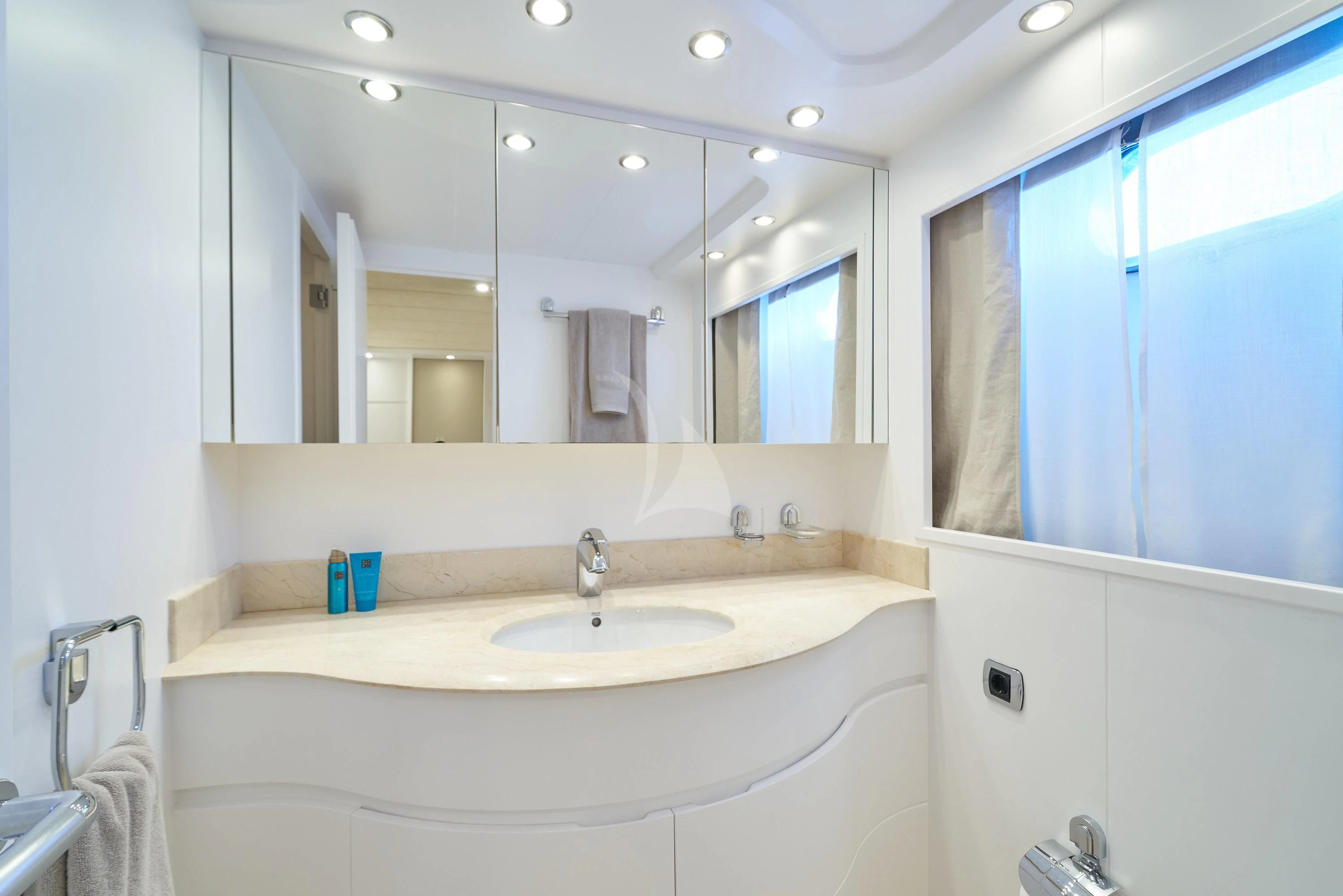 a bathroom with a large mirror aboard KIAWAH II Yacht for Sale