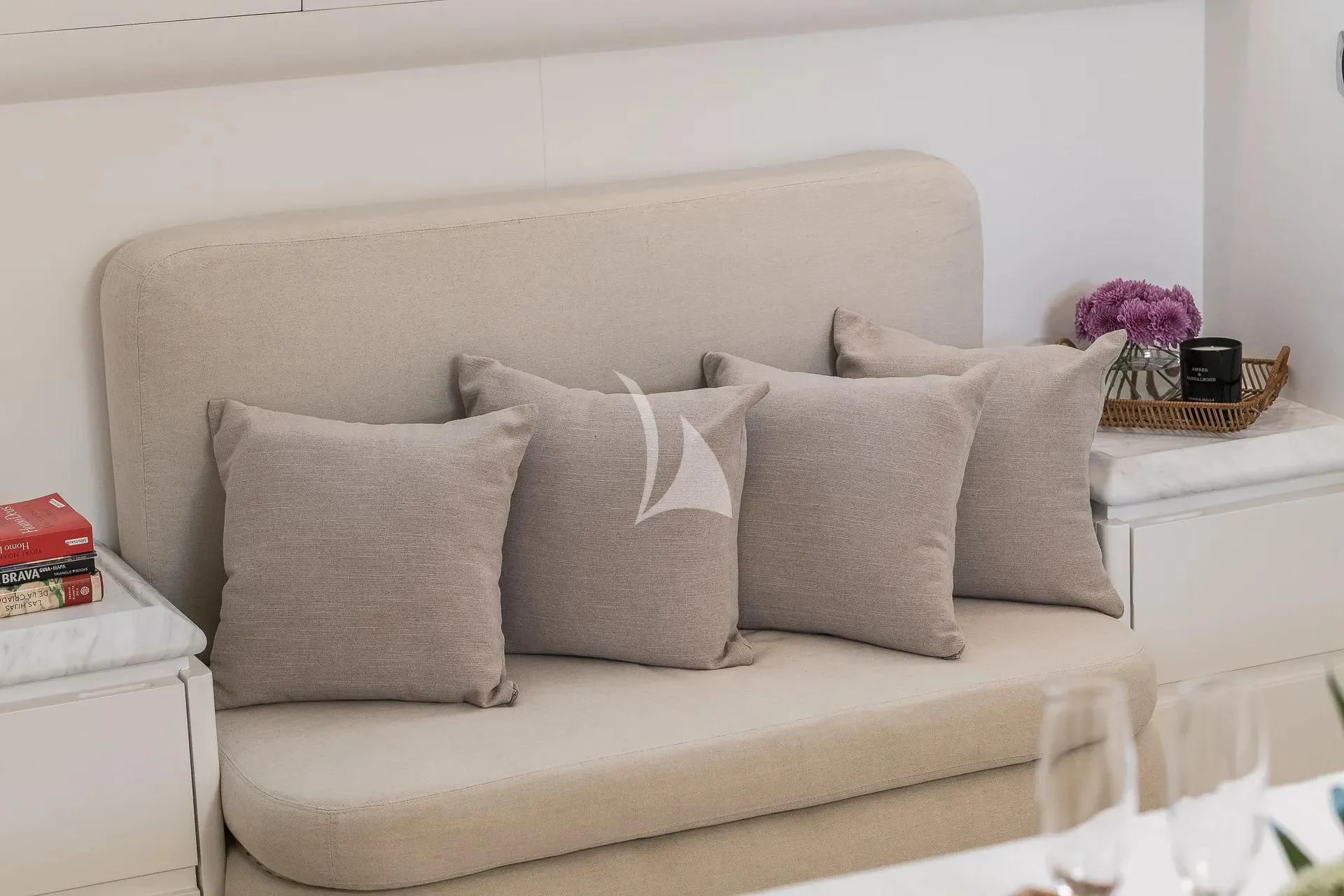 a white couch with pillows aboard KIAWAH II Yacht for Sale