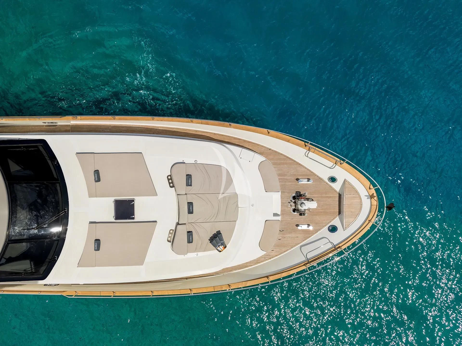 a white boat with a number on it aboard KIAWAH II Yacht for Sale