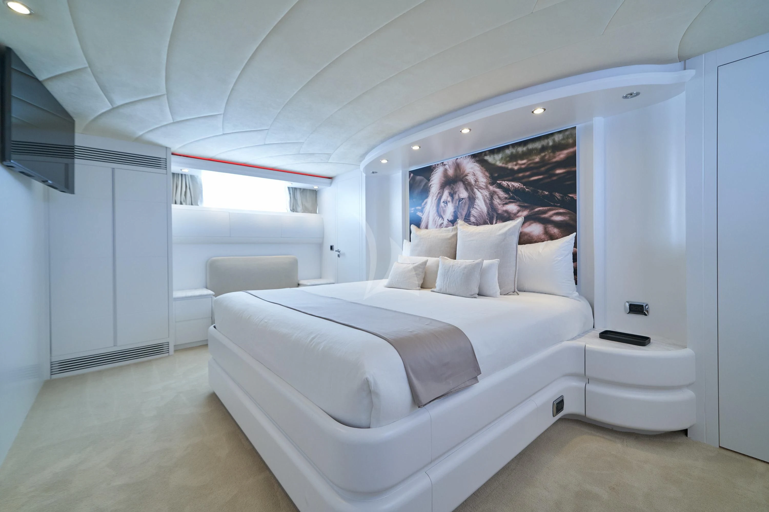 a white bed in a room aboard KIAWAH II Yacht for Sale
