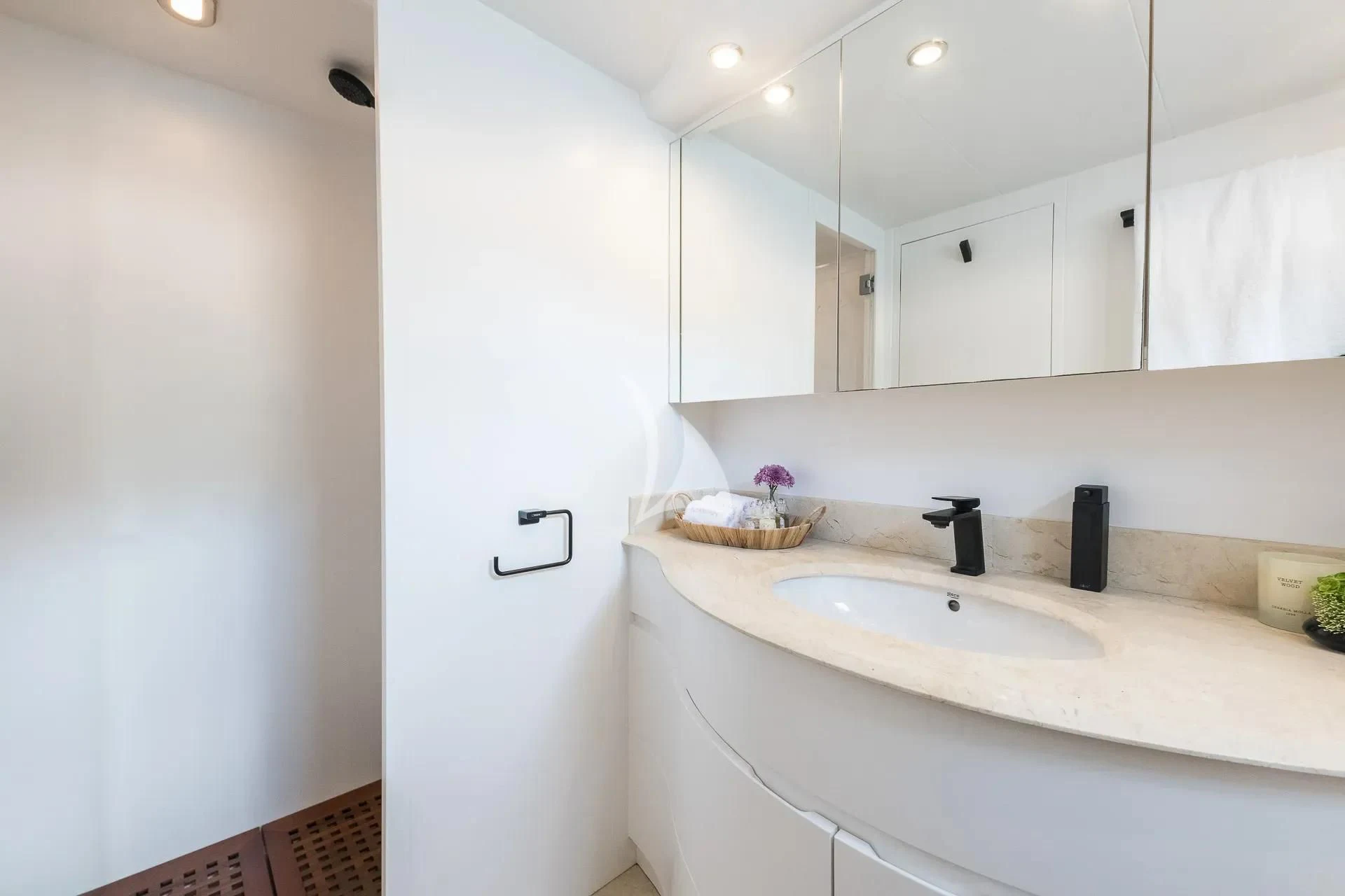 a bathroom with a sink and a mirror aboard KIAWAH II Yacht for Sale