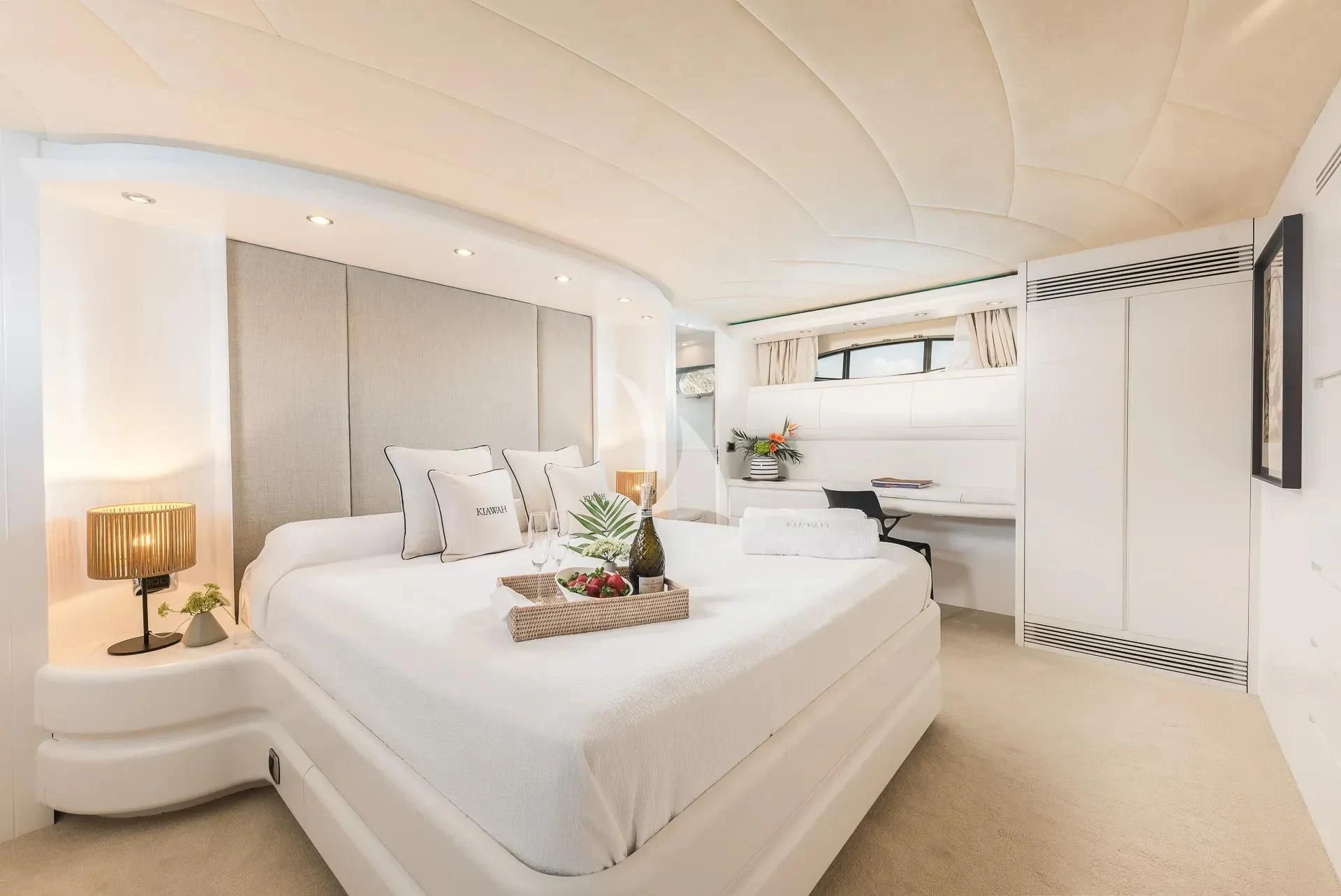 a room with a bed and a table aboard KIAWAH II Yacht for Sale