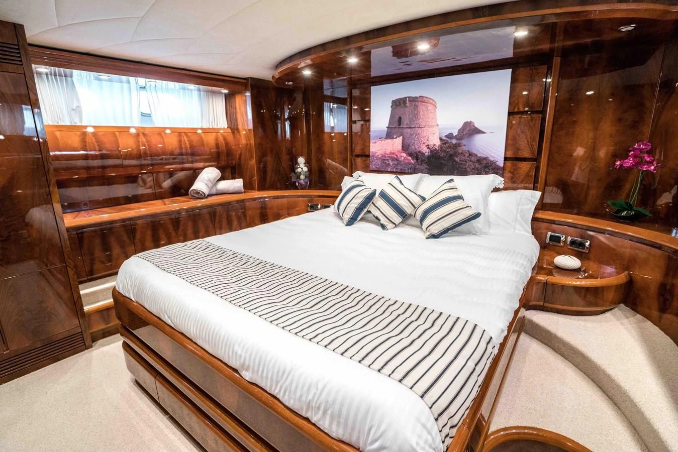 a room with a bed and a mirror aboard KIAWAH II Yacht for Sale