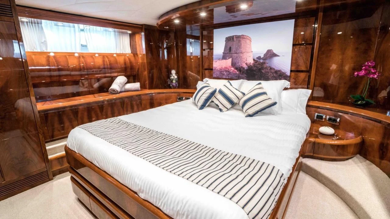 a bed in a room aboard KIAWAH II Yacht for Sale