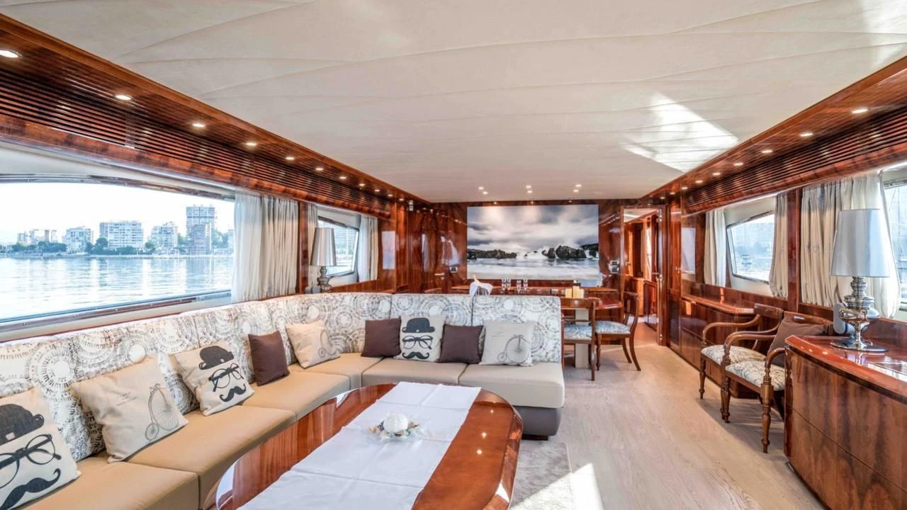 a living room with a large window aboard KIAWAH II Yacht for Sale