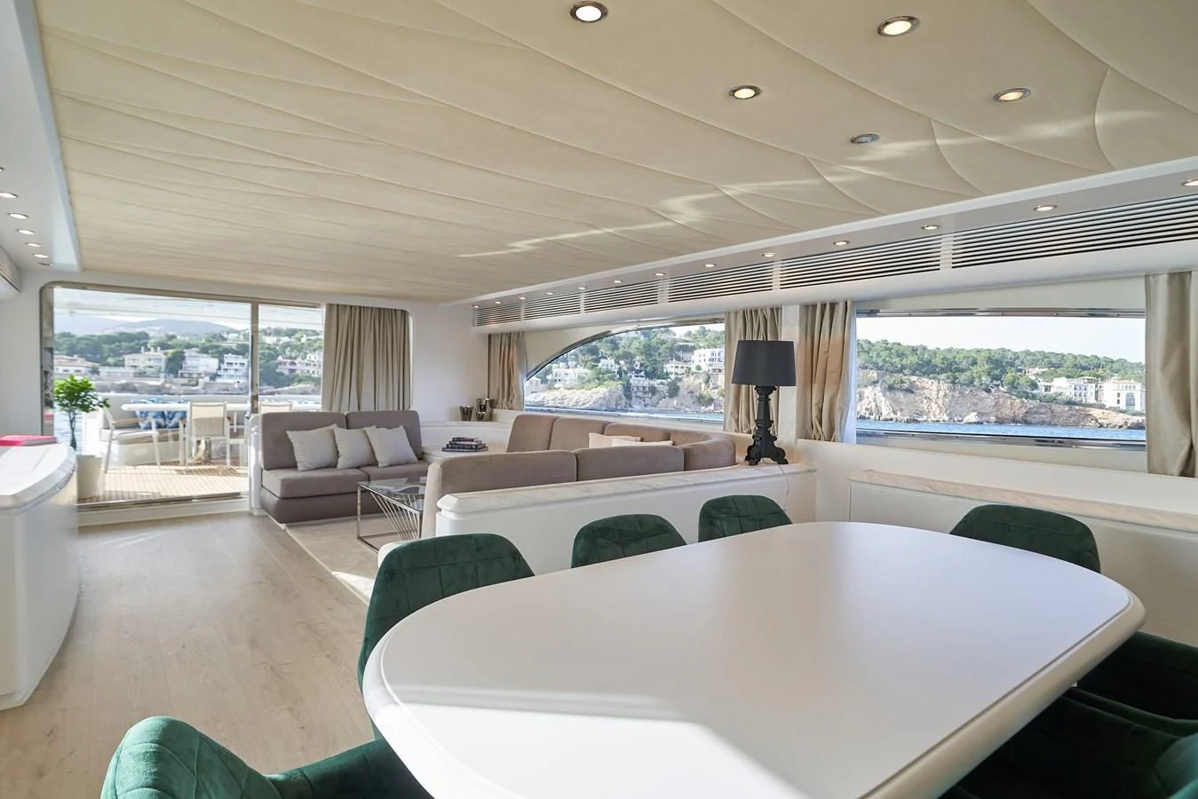 a large living room with a large window aboard KIAWAH II Yacht for Sale