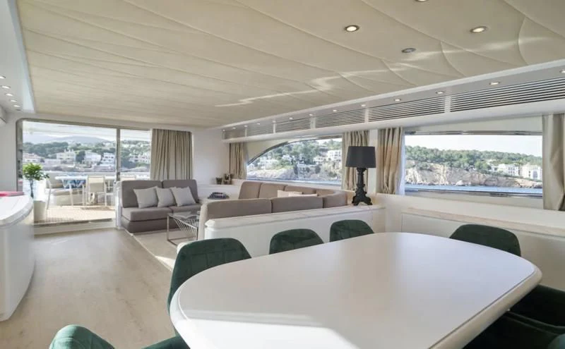 a large living room with a large window aboard KIAWAH II Yacht for Sale