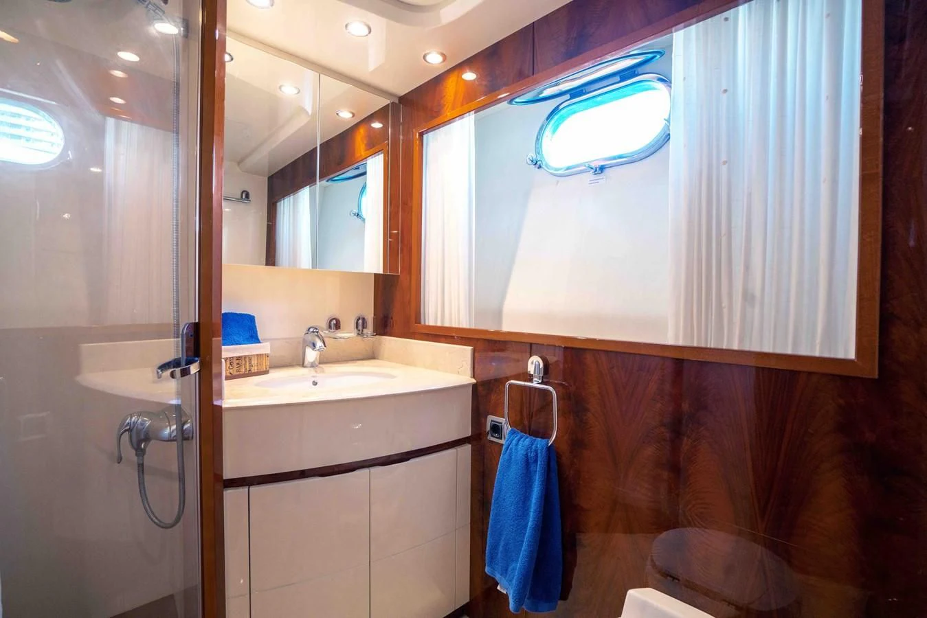 a bathroom with a sink and a mirror aboard KIAWAH II Yacht for Sale