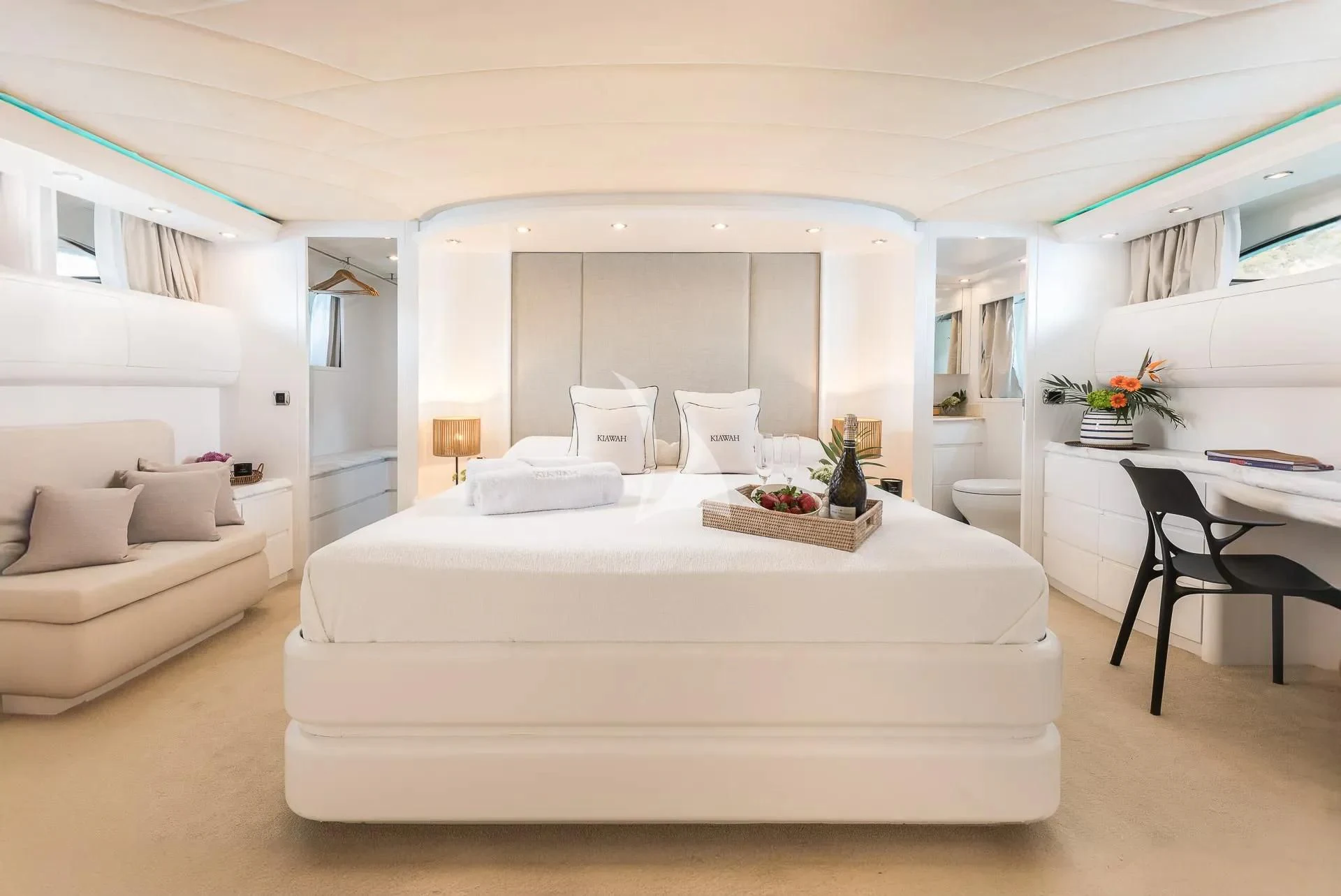 a living room with a white couch aboard KIAWAH II Yacht for Sale