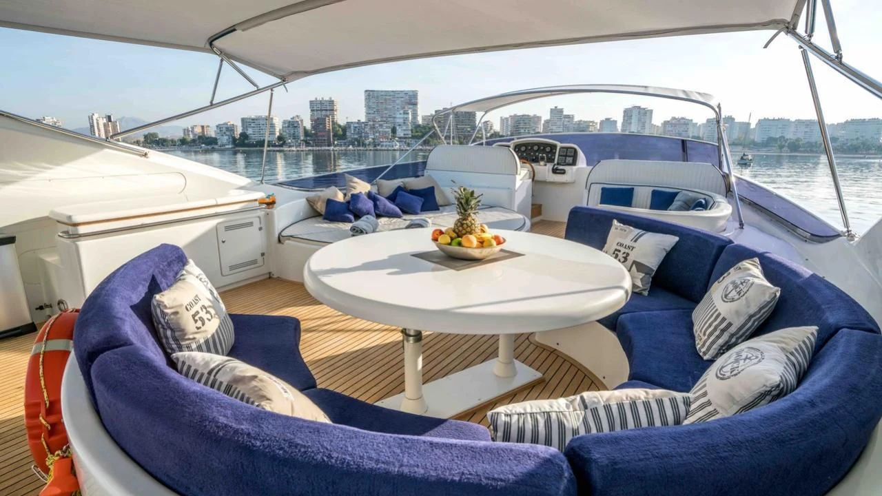 a boat with a table and a plate of food on it aboard KIAWAH II Yacht for Sale